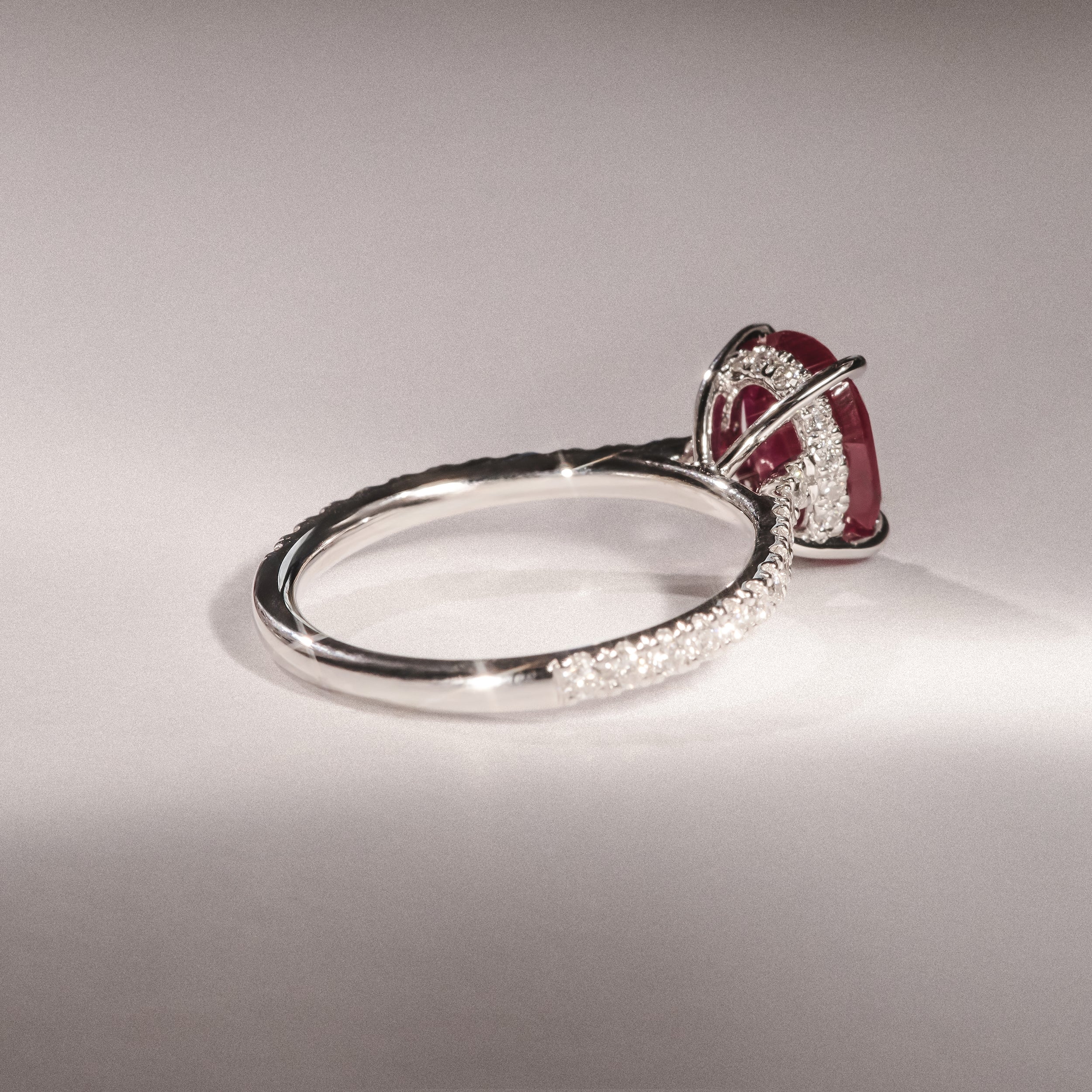 Amora 2.00ct Oval Cut Lab Ruby Hidden Halo Engagement Ring with Side Stones in 18K White Gold - Image 8