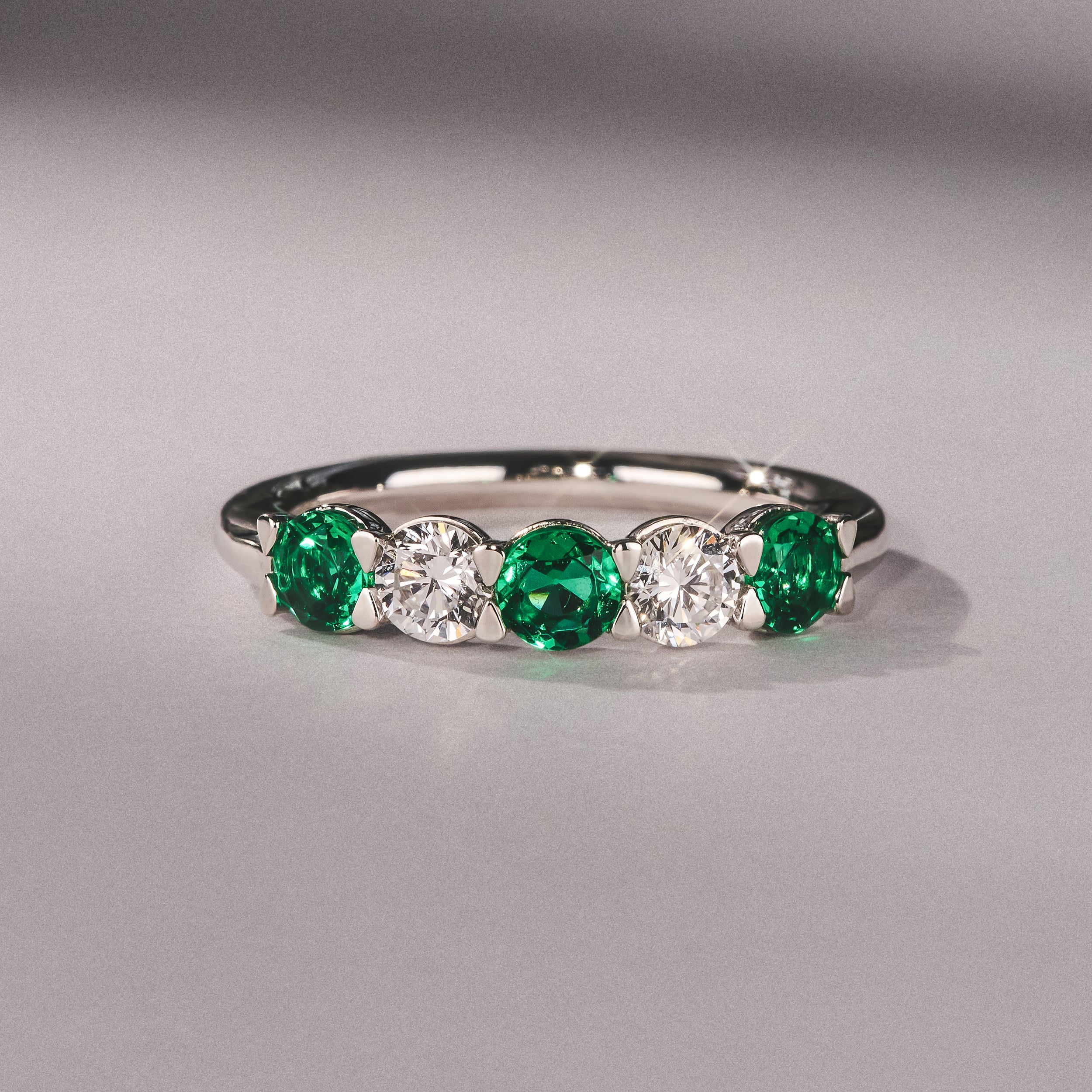 Solene 0.75ct Round Cut Lab Emerald and Lab Diamond Half Eternity Ring in 18K White Gold - Image 6